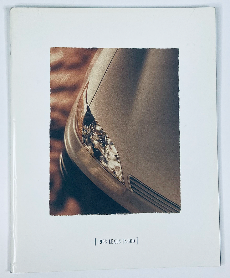 Cover image of the 1993 Lexus ES 300 Lineup Dealer Showroom Sales Brochure Guide Catalog, showcasing the distinctive headlight design of the car with an elegant aesthetic.