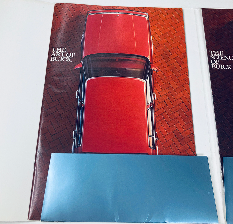 Interior page of the 1985 Buick Dealer Showroom Sales Brochure showcasing an overhead view of a red Buick car on a brick pavement.