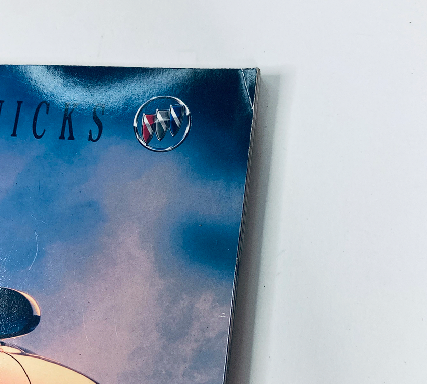 Close-up of the 1997 Buick Dealer Showroom Sales Brochure Guide Catalog showcasing the Buick logo and a portion of the brochure cover.