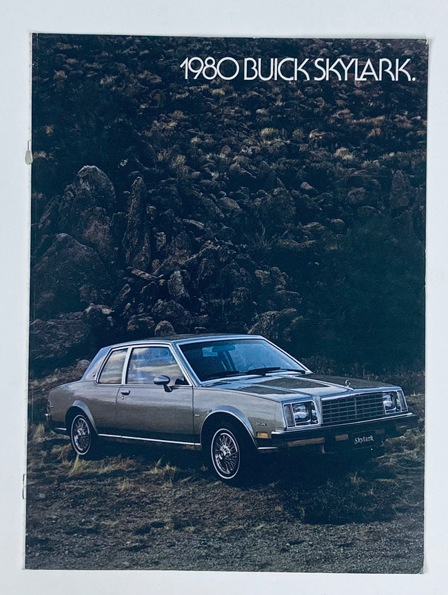 1980 Buick Skylark Dealer Showroom Sales Brochure Guide Catalog featuring a silver Buick Skylark parked in a rocky landscape, showcasing the car's design and style.
