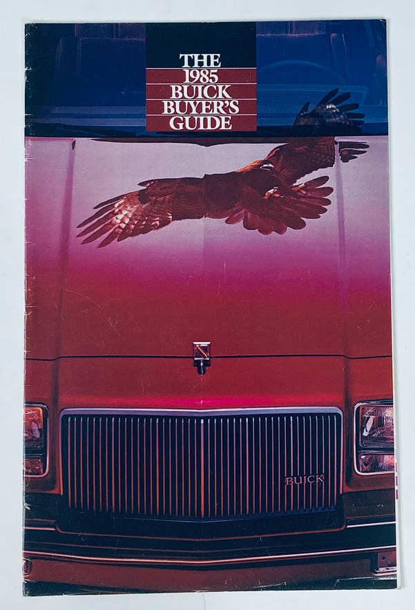 1985 Buick Dealer Showroom Sales Brochure Guide Catalog featuring a red Buick hood with an eagle graphic overhead, showcasing the vehicle and promotional design.