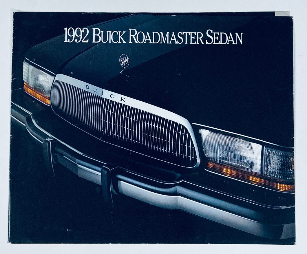 Close-up view of the front grille and headlights of a 1992 Buick Roadmaster Sedan showcased in a sales brochure.