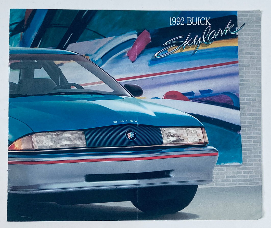 1992 Buick Skylark Dealer Showroom Sales Brochure showcasing a blue Buick Skylark with a vibrant artistic background, highlighting the car's design features and elegance.