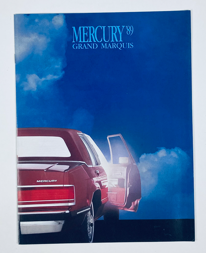 1989 Mercury Grand Marquis Dealer Showroom Sales Brochure Guide Catalog cover featuring the rear view of a Mercury Grand Marquis car against a blue sky background.