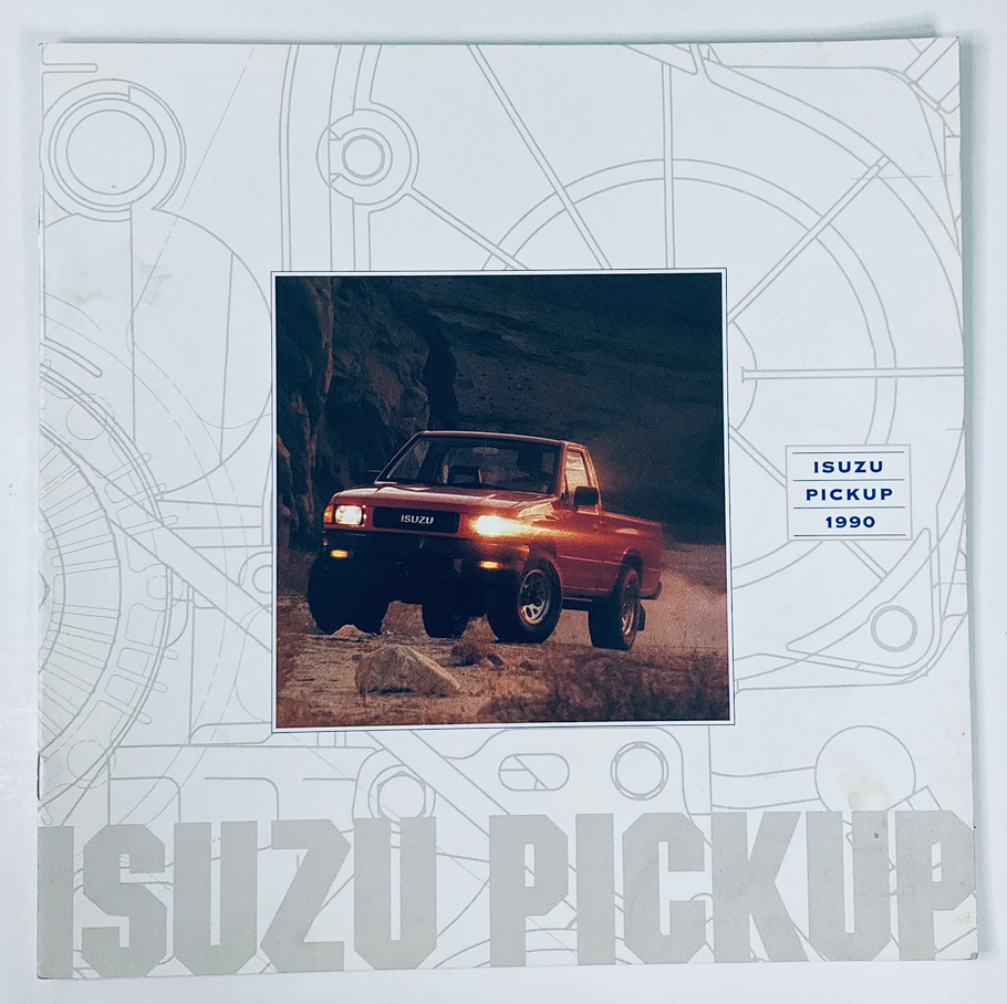 1990 Isuzu Pickup Dealer Showroom Sales Brochure showcasing the Isuzu Pickup with a bold design and a scenic background.