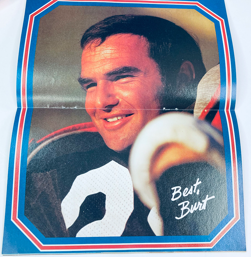 Interior page with a mini-poster from VTG SuperMag Magazine Vol 4 No. 1 showcasing an authentic photograph of Burt Reynolds with a friendly smile, signed 'Best, Burt'.
