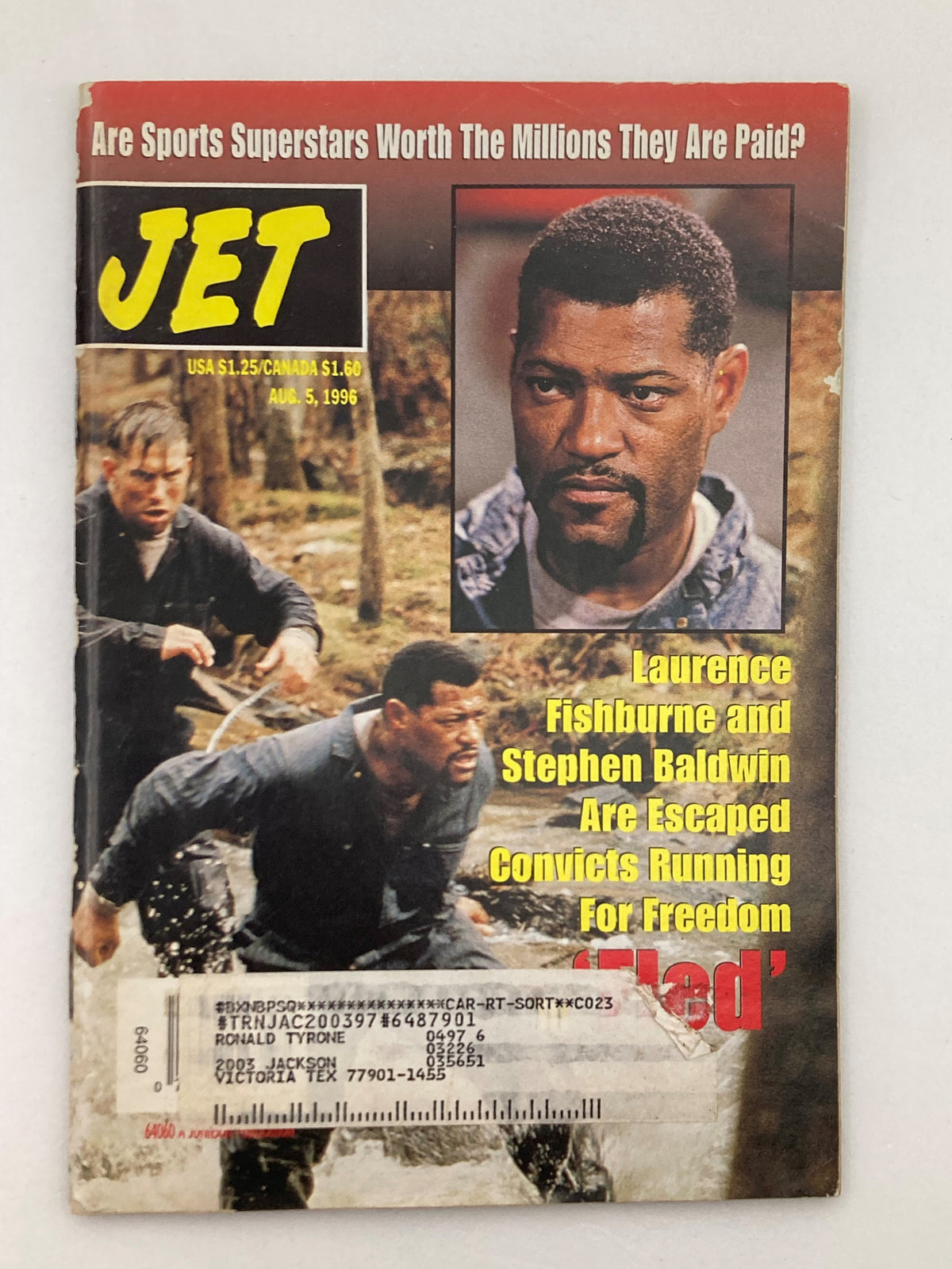 Cover of Jet Magazine from August 5, 1996, Vol 90 #12 featuring Laurence Fishburne and Stephen Baldwin with headline discussing sports salaries and their role in the film 'Fled'. Good condition with address label on front.