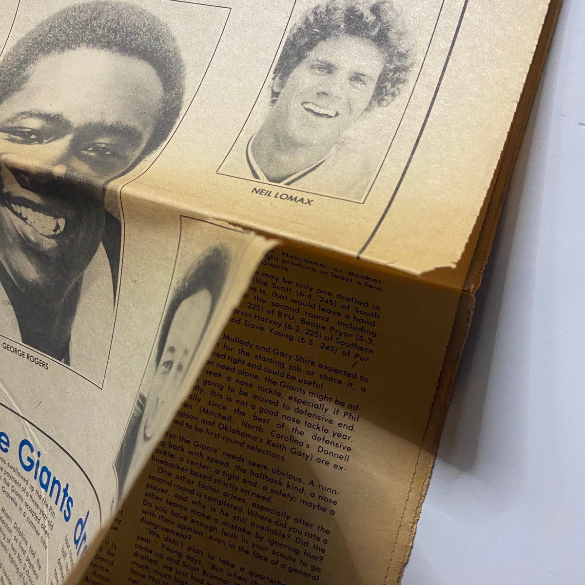 Close-up view of The Giant Newsweekly April 13 1981 Vol 1 No. 1, showcasing George Rogers and Neil Lomax with text discussing the Giants' draft strategy.