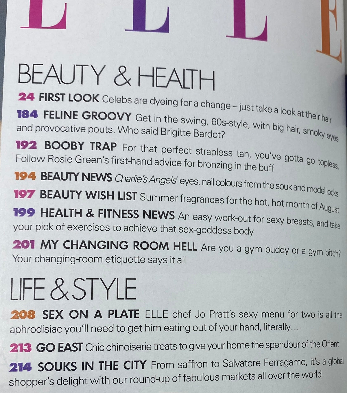 Interior page of Elle UK Magazine August 2003, displaying health and beauty article titles including '24 First Look' and '192 Booby Trap', reflecting on popular trends and advice from that era.