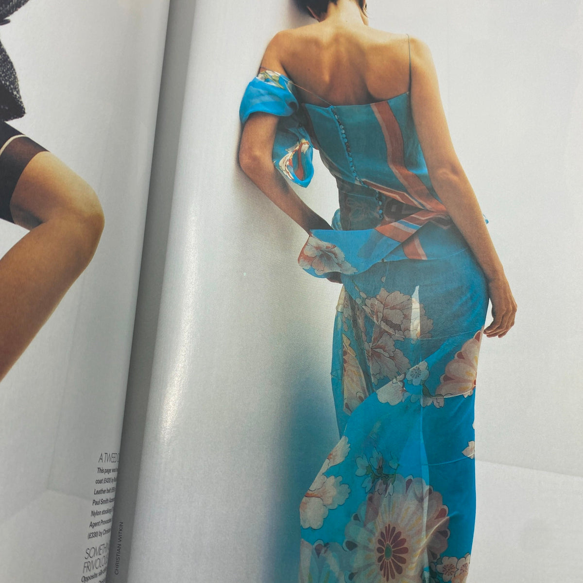 Fashion spread from Elle UK Magazine August 2003, illustrating a model in a flowing floral dress, symbolizing the vibrant styles of the early 2000s and connected to the featured content on fashion.