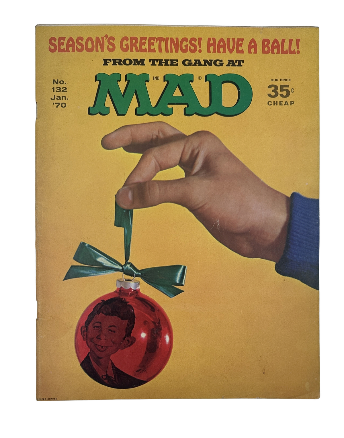 MAD Magazine No. 132 January 1970 cover featuring a hand holding a Christmas ornament with a character's portrait. The cover features festive colors and invites readers to enjoy seasonal greetings.