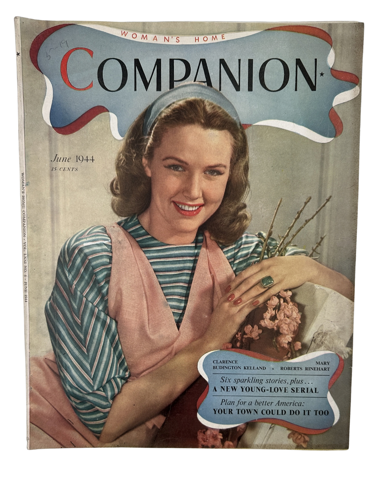 Cover image of Woman’s Home Companion Magazine from June 1944 featuring Mary Roberts Rinehart and Clarence Kelland. The cover showcases a smiling woman wearing a pink dress with a blue headband, surrounded by flowers.