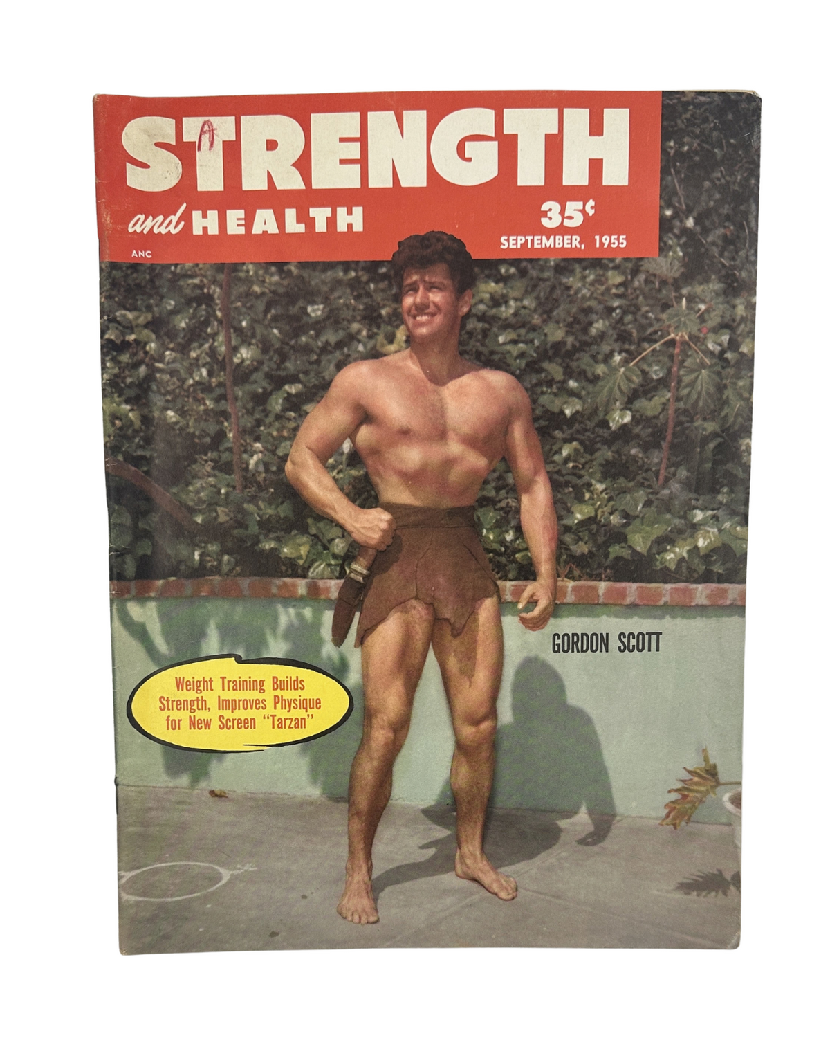 Cover of Strength and Health Magazine September 1955 featuring Gordon Scott, showcasing a muscular man in a tarzan costume, emphasizing fitness and weight training.