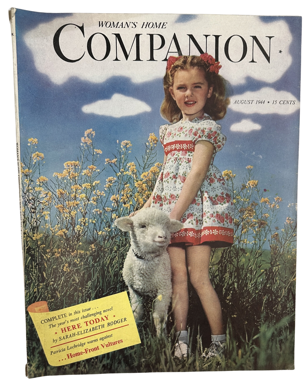 Cover of Woman’s Home Companion Magazine for August 1944 featuring a young girl in a floral dress standing beside a sheep in a field, highlighting the title 'Here Today' by Sarah-Elizabeth Rodger.