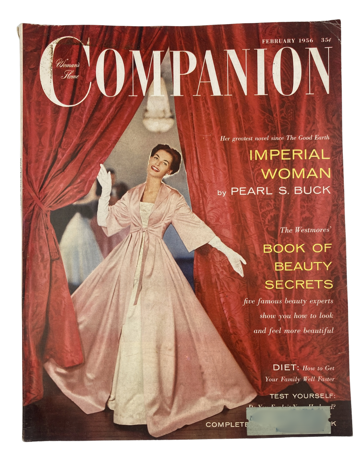 Woman's Home Companion Magazine from February 1956 featuring 'Imperial Woman' by Pearl S. Buck on the cover, showcasing a woman in a pink dress against a red background, representing classic vintage aesthetics.