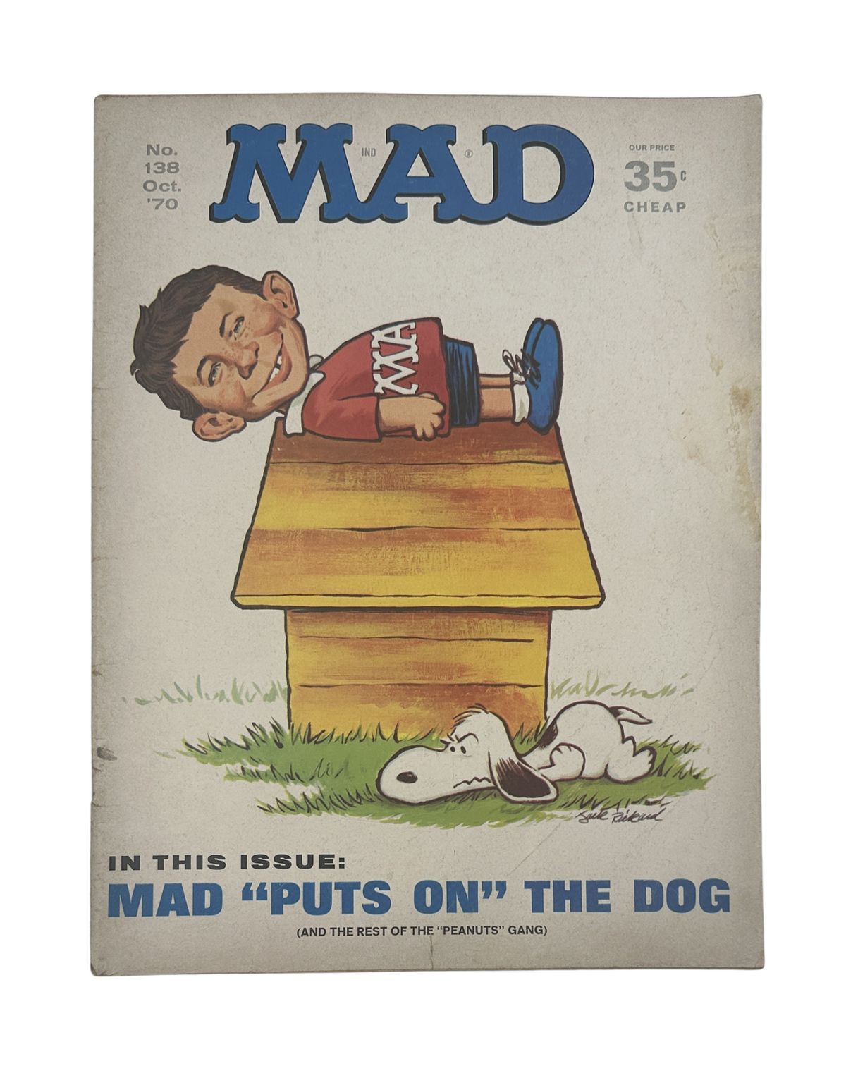 Cover of MAD Magazine No. 138 from October 1970, featuring a caricatured child sitting on a doghouse, accompanied by Snoopy, with the title 'MAD PUTS ON THE DOG'.