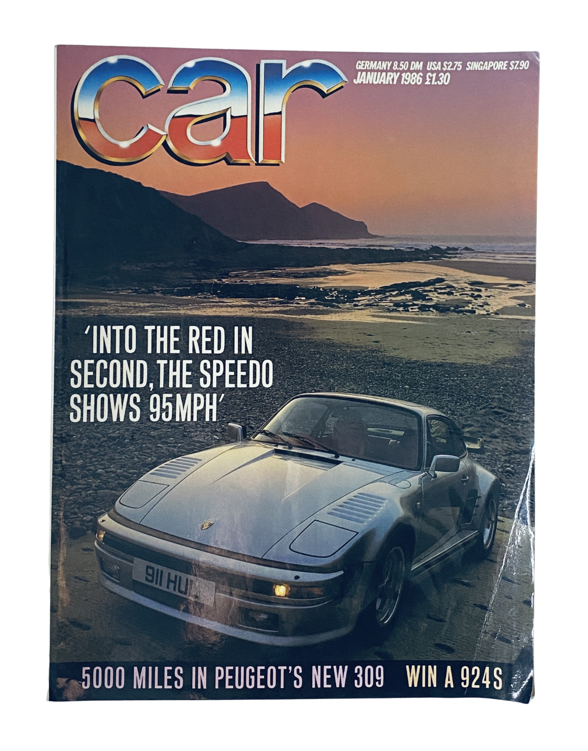 CAR Magazine January 1986 cover featuring a Porsche 911 Turbo with a scenic beach background and article highlights about driving performance and Peugeot 309 test.