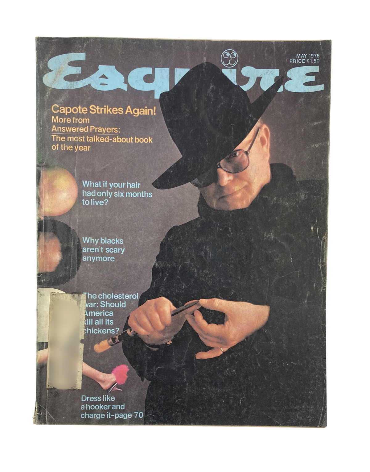 Cover of Esquire Magazine, May 1976 featuring Truman Capote titled 'Capote Strikes Again!' with a mysterious figure in a black hat. Explore the iconic fashion and culture features of the era.