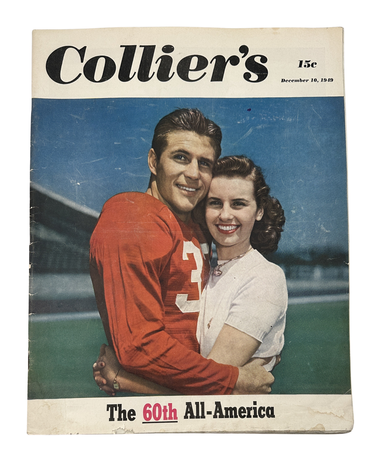 Cover of Collier’s Magazine from December 10, 1949 featuring The 60th All-America, with a smiling couple, the man in a red jersey and the woman in a white blouse.