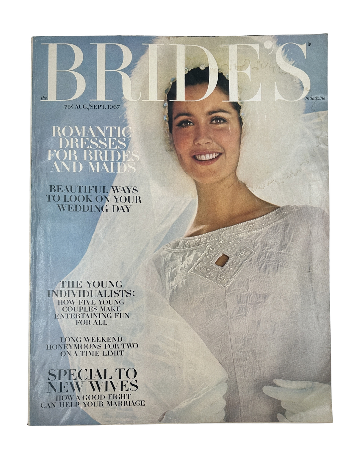 Bride's Magazine August/September 1967 cover featuring a smiling bride wearing a white gown with a veil, focusing on romantic dresses for brides and maids, showcasing beauty tips and honeymoon ideas.