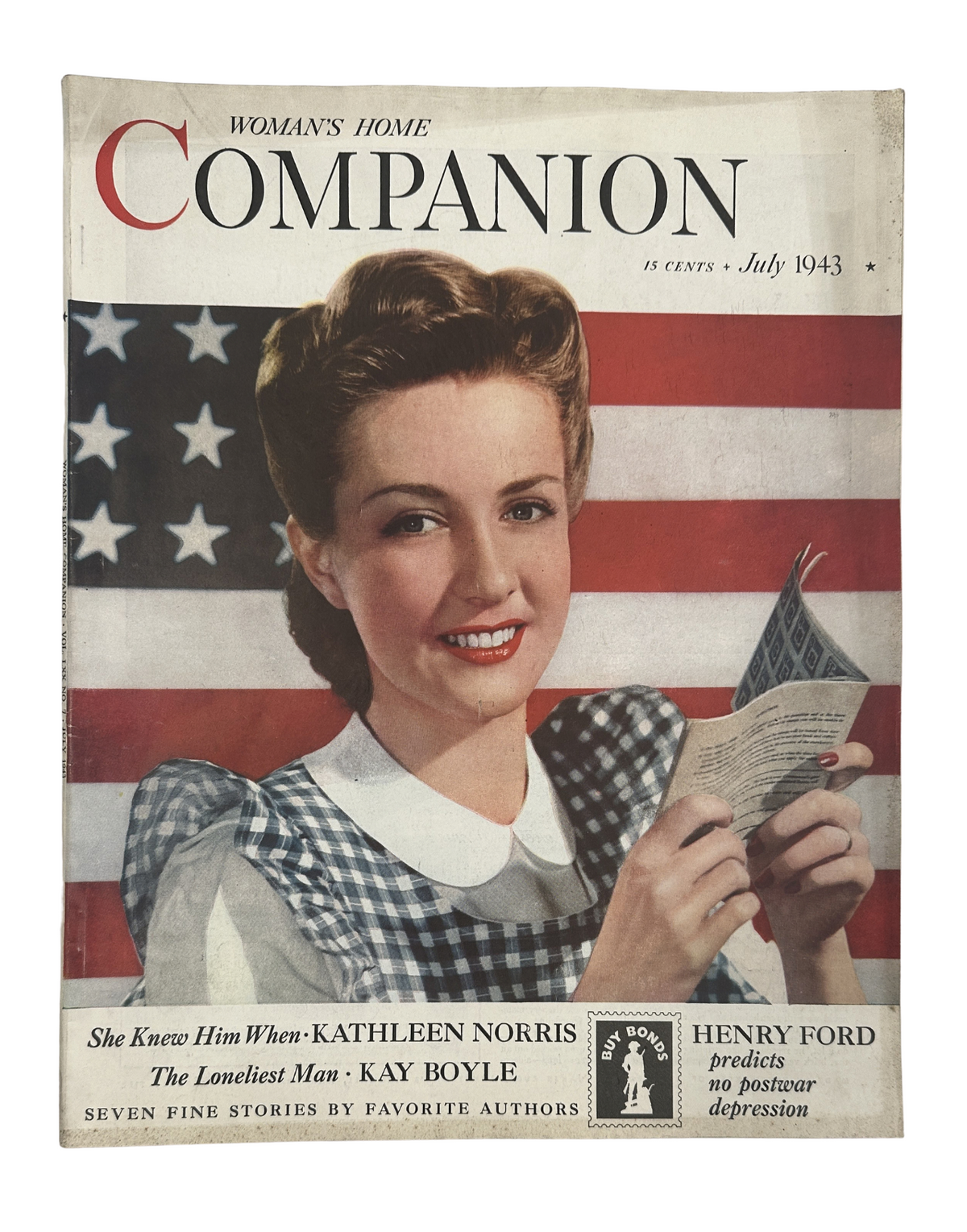 Woman’s Home Companion Magazine July 1943 featuring an American Flag cover, showcasing a woman with styled hair in a polka dot dress, promoting articles and stories within, including contributions by Kathleen Norris and Kay Boyle.