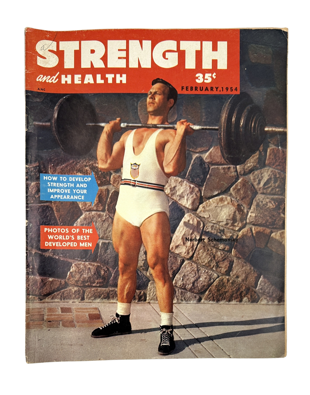 Strength and Health Magazine February 1954 featuring Norbert Schemansky on the cover, showcasing strength training and weightlifting.