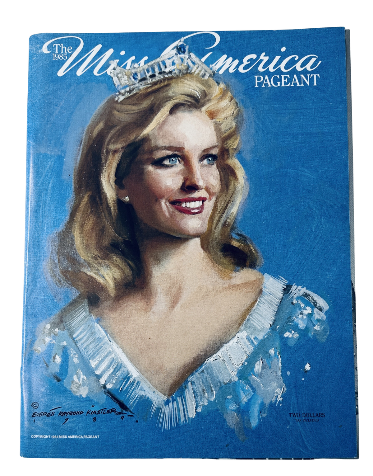The 1985 Miss America Pageant Magazine Official Program featuring a painting of Sharlene Wells on the cover, showcasing her in a glamorous crown and gown.