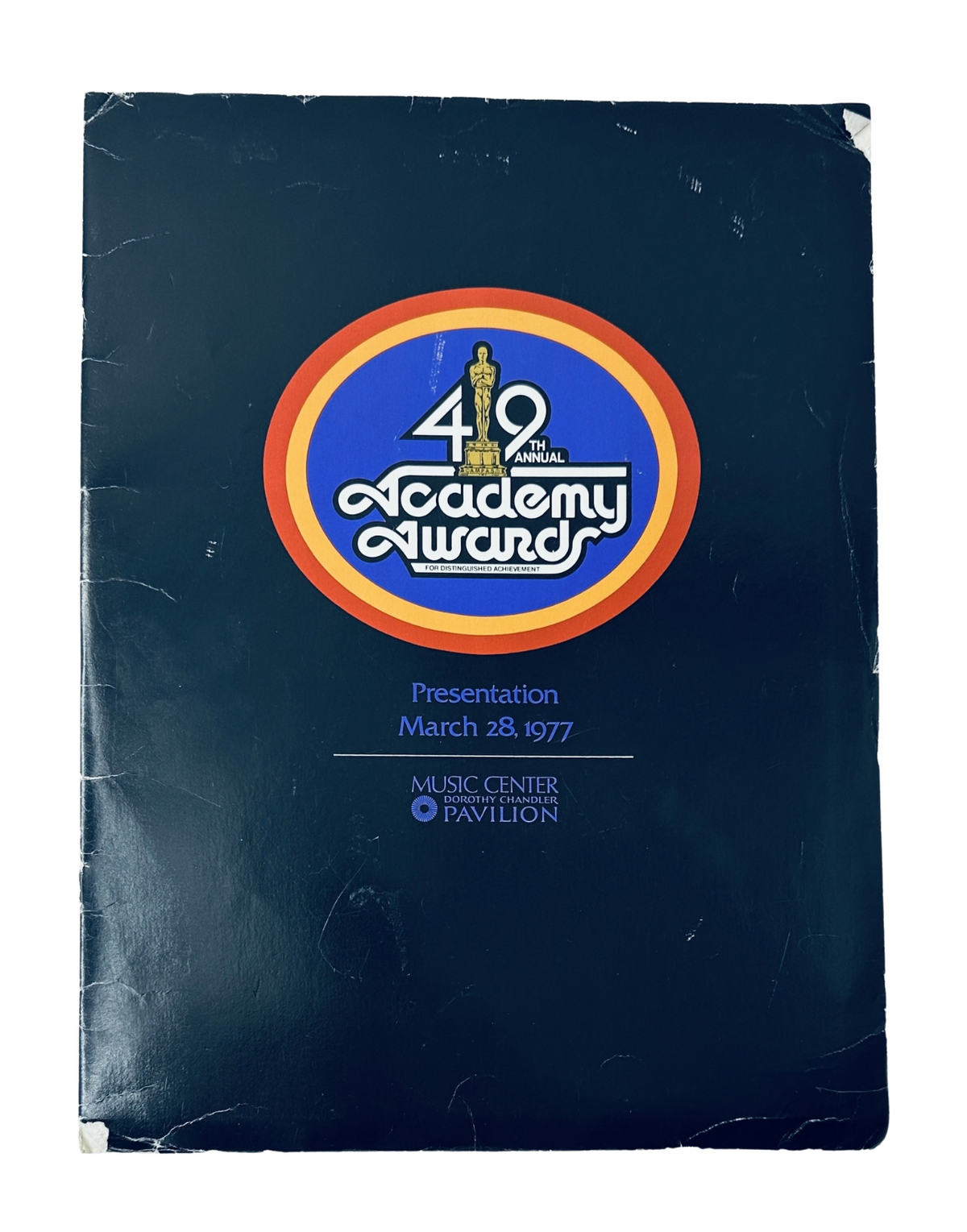 Cover of the 49th Annual Academy Awards Magazine, March 28, 1977, featuring the Academy Awards logo and presentation details.