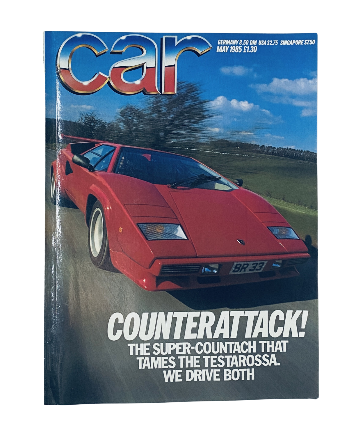 Cover of CAR Magazine May 1985 featuring a Lamborghini Countach, headlined 'COUNTERATTACK! THE SUPER-COUNTACH THAT TAMED THE TESTAROSSA. WE DRIVE BOTH.' The magazine highlights a comparison of the iconic supercars.