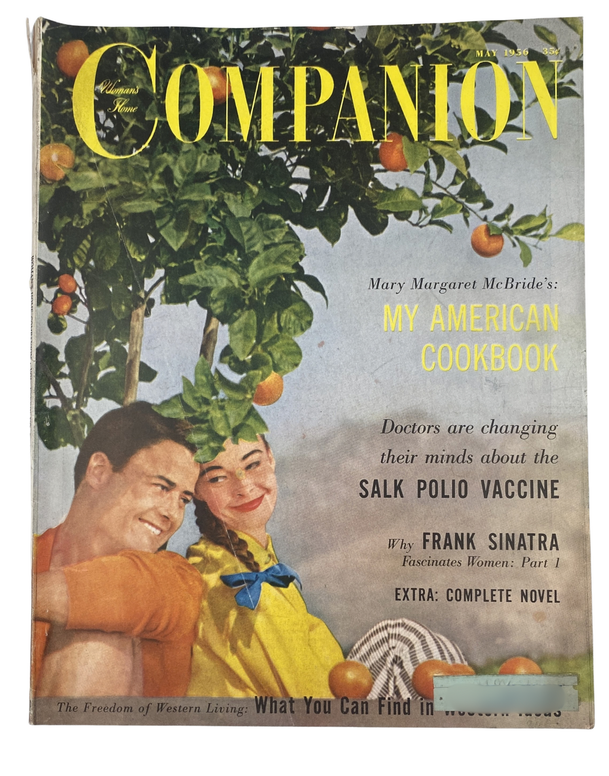 Cover of Woman’s Home Companion Magazine May 1956 featuring 'My American Cookbook' by Mary Margaret McBride, with a feature on the Salk Polio Vaccine and an article on Frank Sinatra. The magazine includes vibrant imagery of fruits, emphasizing themes of American homemaking and cooking.