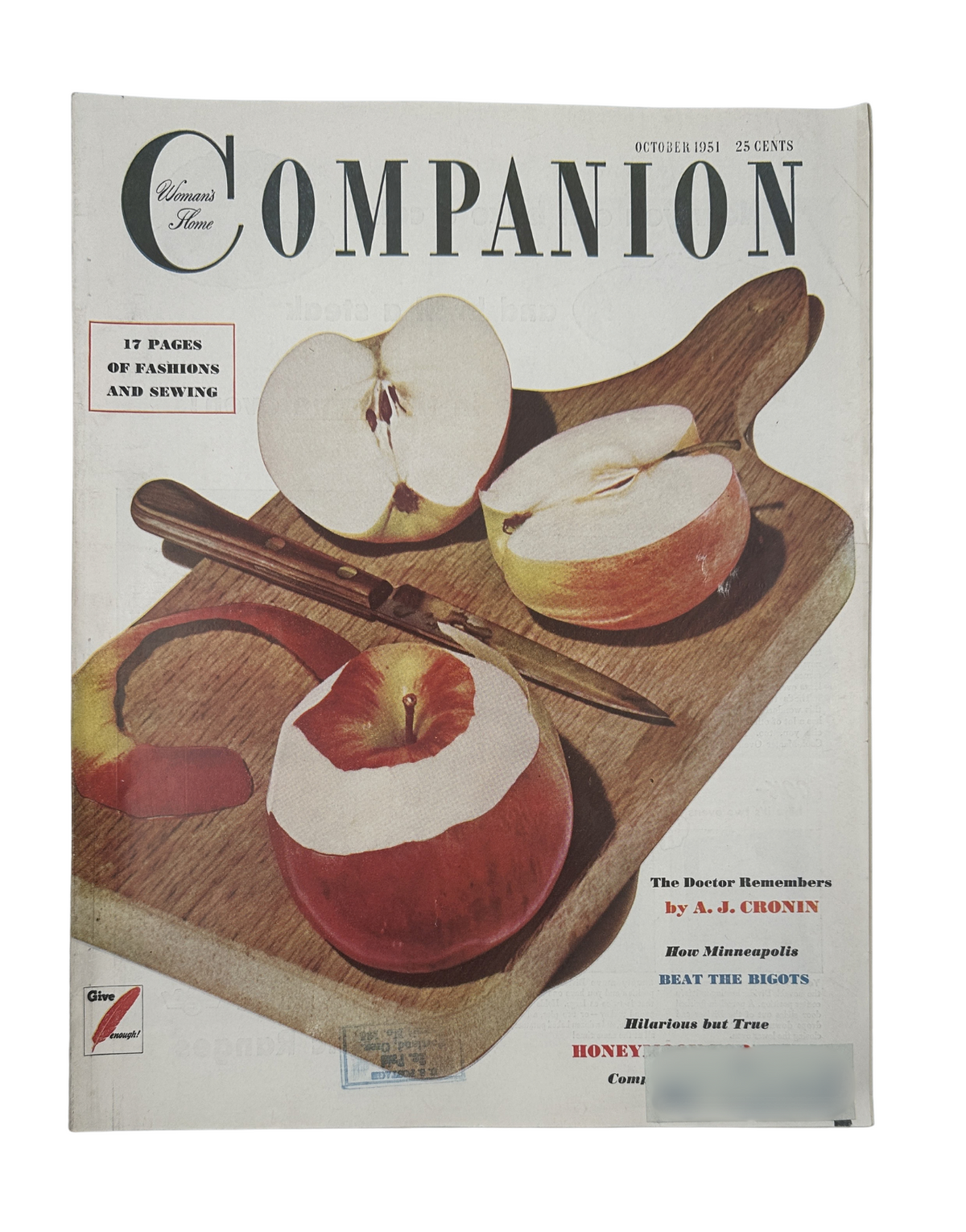 Cover of Woman’s Home Companion Magazine, October 1951 featuring a color photograph of apples on a wooden cutting board, highlighting the articles by A.J. Cronin and Patricia Highsmith.