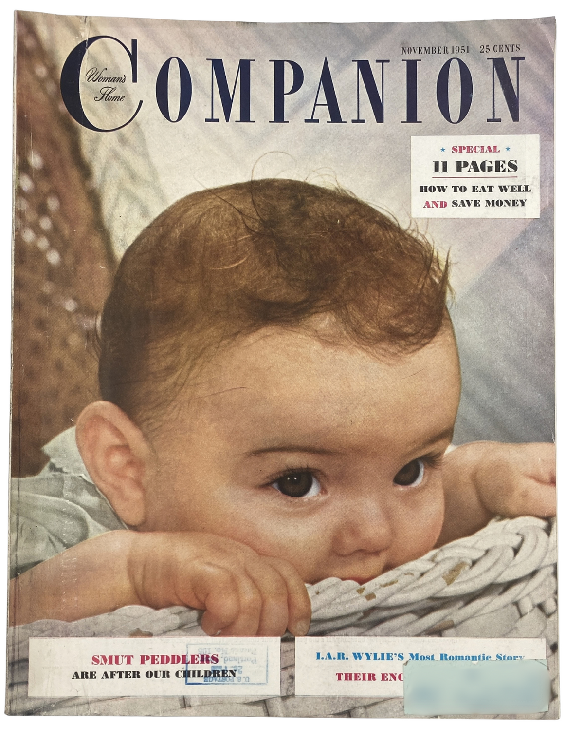 Cover of Woman's Home Companion Magazine, November 1951, featuring a close-up of a baby on the front. Highlights include articles on child safety and feeding tips, with a prominent mention of 'Smut Peddlers Are After Our Children'.