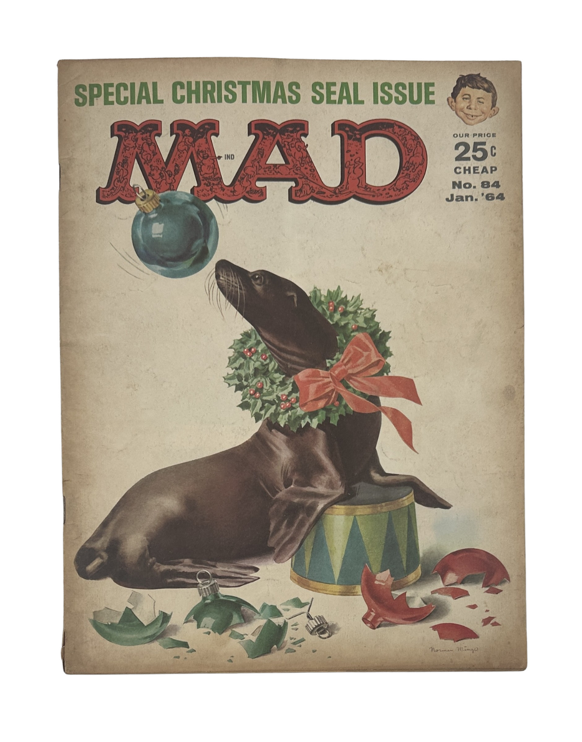 Cover of MAD Magazine No. 84 January 1964 Christmas Seal Issue featuring a playful dog with a Christmas wreath, reflecting the comedic and festive nature of the magazine. Perfect for collectors of vintage humor magazines.