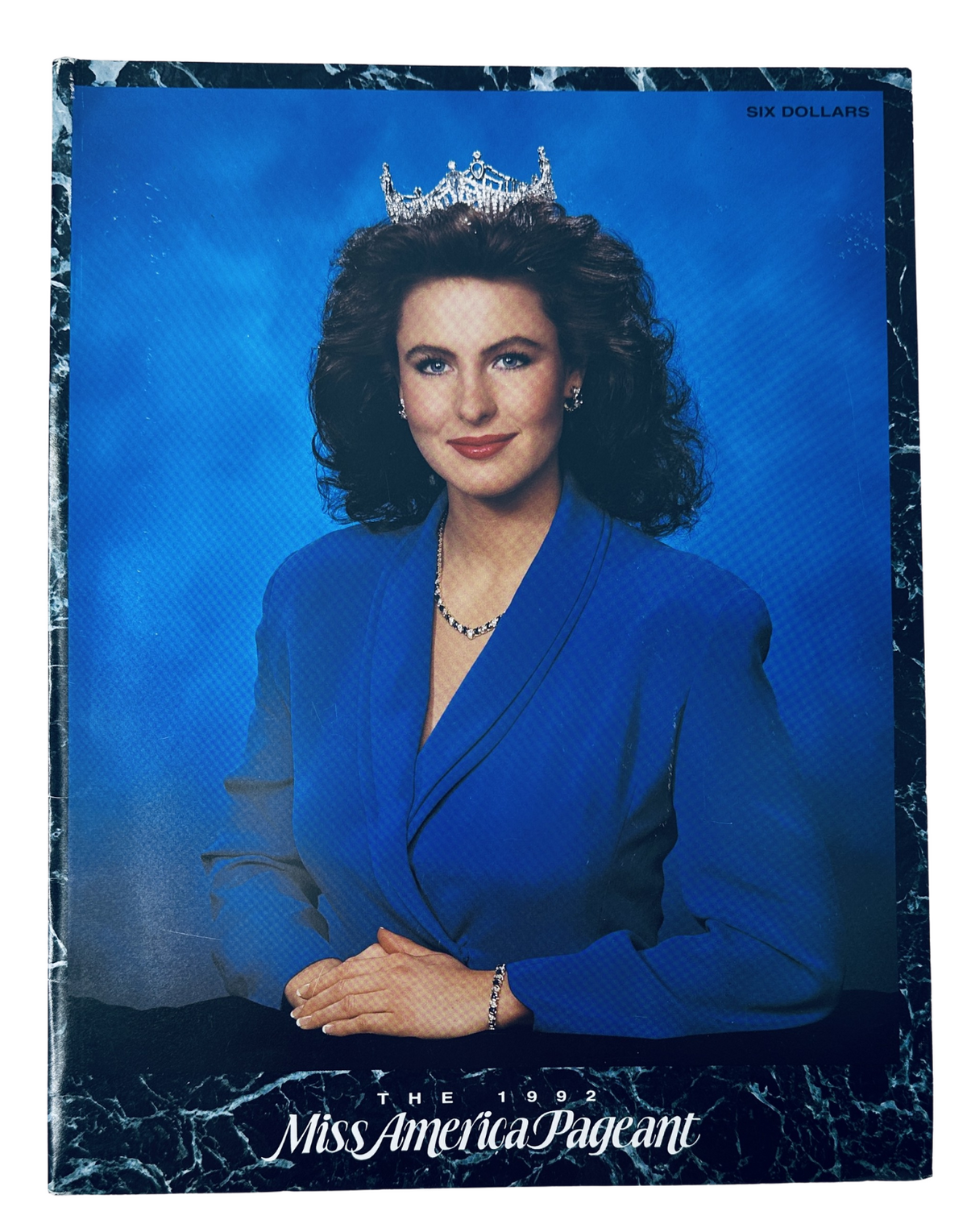 Cover of The 1992 Miss America Pageant Magazine Official Program featuring Heather Whitestone, showcasing her elegant portrait in a blue blazer and crown, presented in a visually appealing layout.