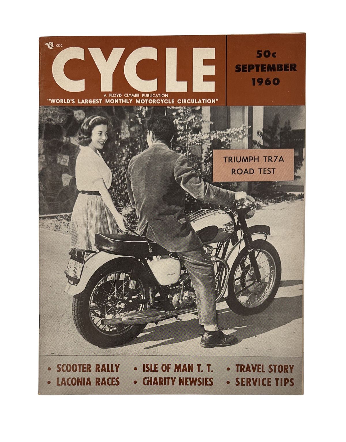 Cycle Magazine from September 1960 featuring the Triumph TR7A road test with advertisements highlighting Laconia Races, Isle of Man TT, charity news, and travel stories.