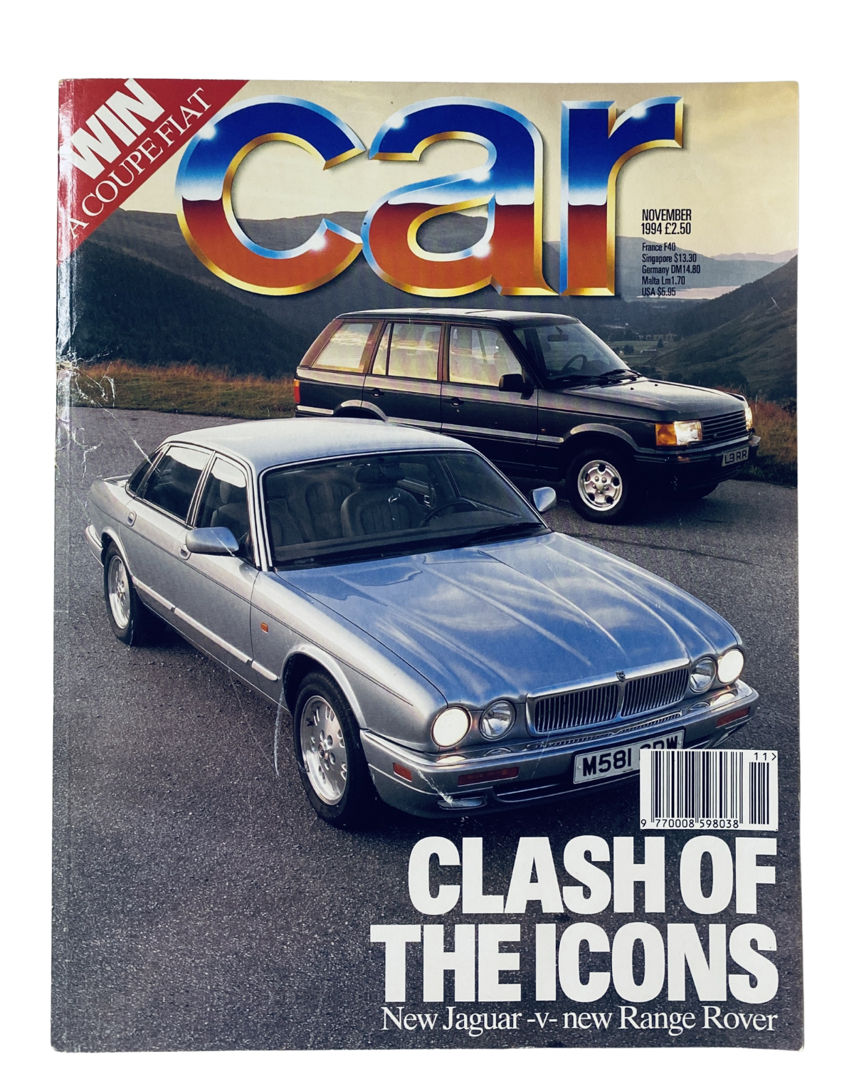 Cover of CAR Magazine November 1994 featuring a clash of the icons between the Jaguar XJ6 and the new Range Rover. The magazine showcases an eye-catching image of both vehicles.