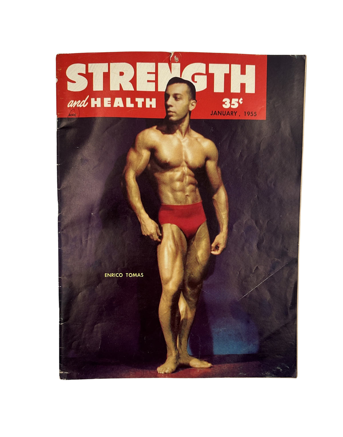 Cover of Strength and Health Magazine January 1955 featuring Enrico Tomas, Mr. Universe, showcasing a muscular pose.