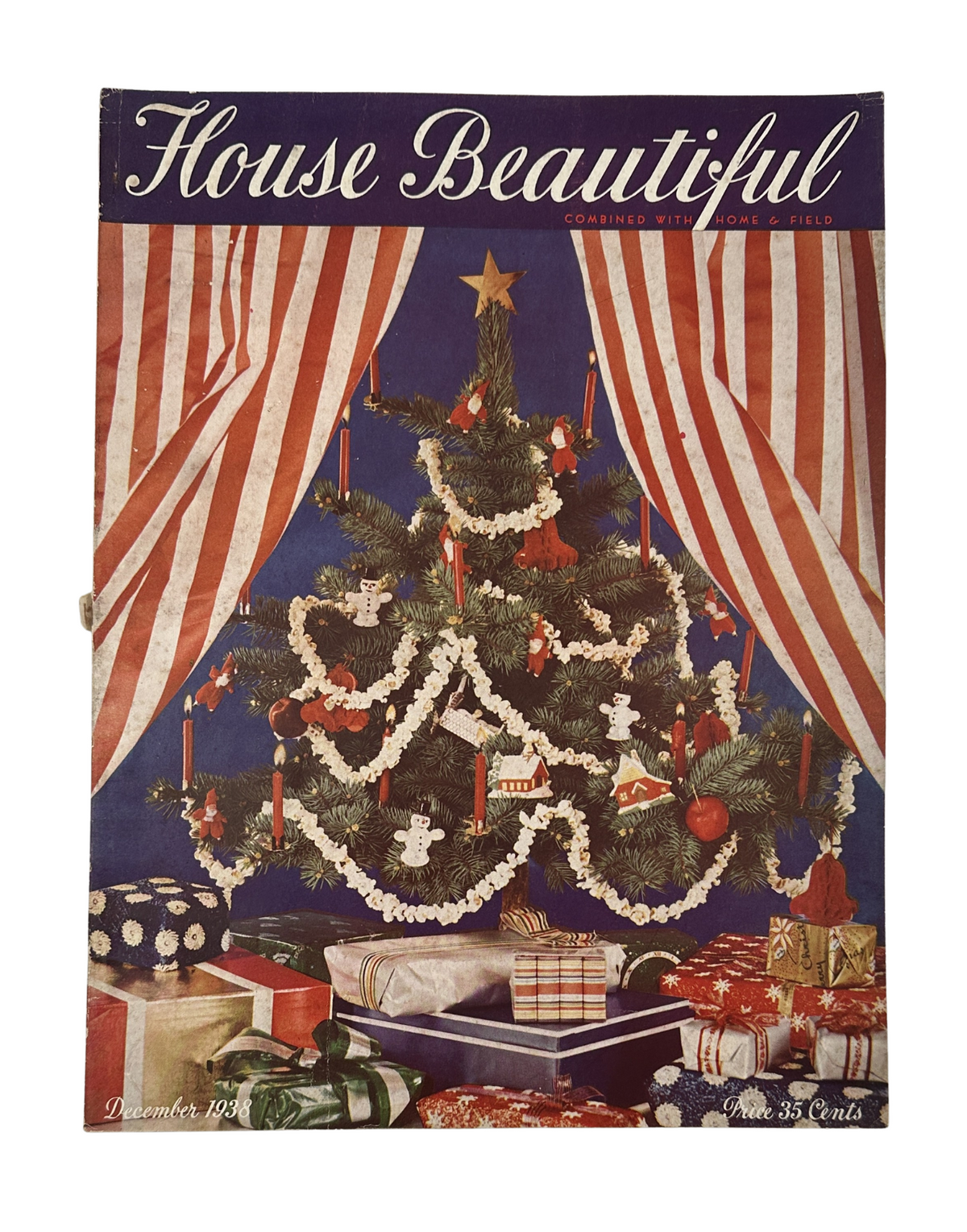 Cover of House Beautiful Magazine, December 1938, featuring a beautifully decorated Christmas tree with red and white striped curtains and wrapped gifts underneath.