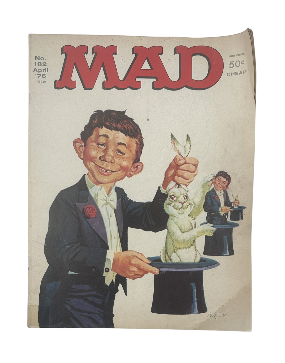 MAD Magazine No. 182 April 1976 cover featuring a caricature of a young boy performing a magic trick with a rabbit, showcasing the signature humor of the series.