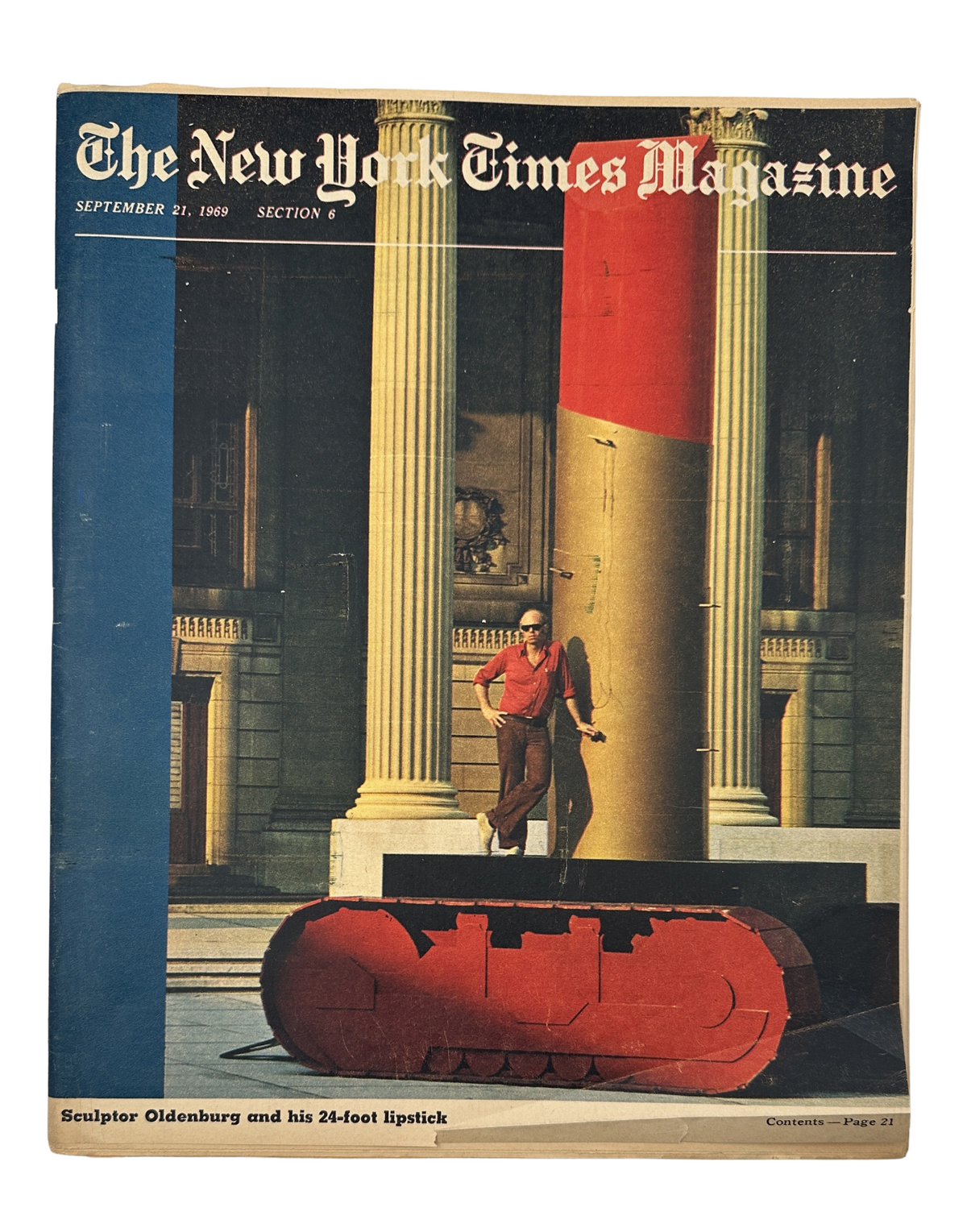 The New York Times Magazine cover from September 21, 1969, featuring sculptor Claes Oldenburg standing next to his 24-foot sculpture of Lipstick on a Caterpillar Track, showcasing the iconic pop art piece in front of architectural columns.