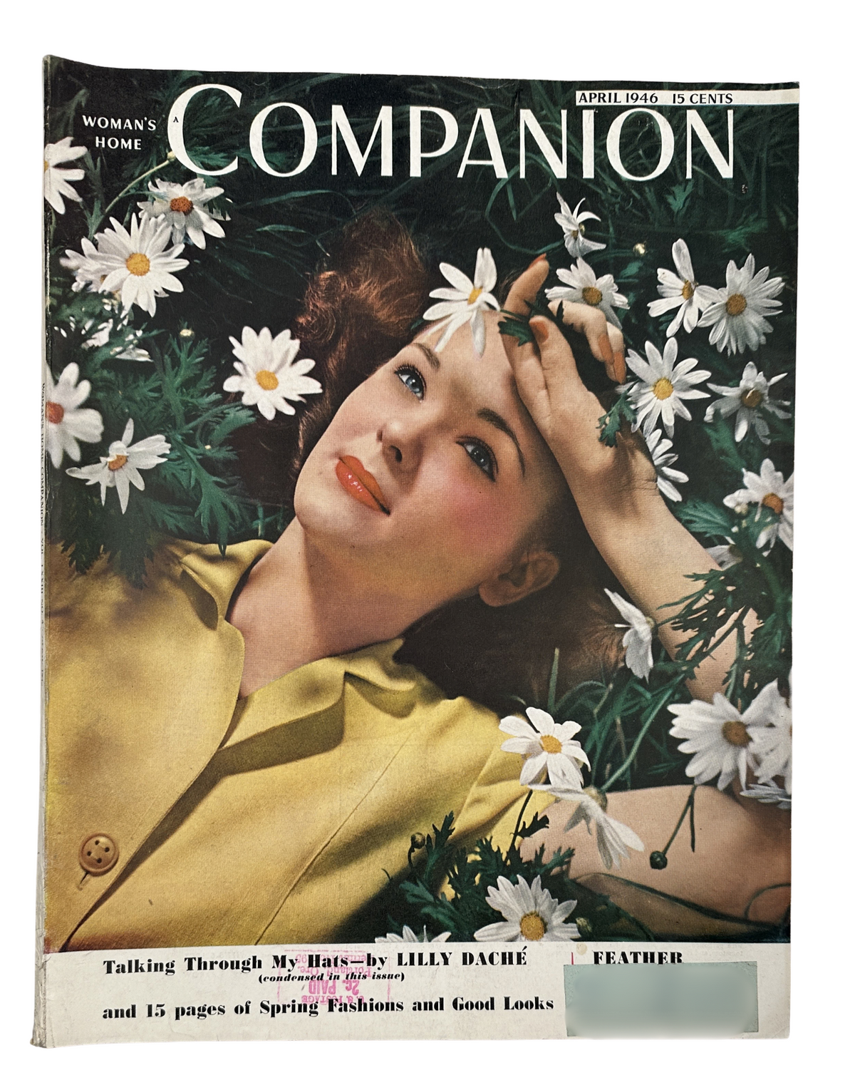 Woman’s Home Companion Magazine April 1946 featuring a cover design by Lily Daché showcasing spring fashions, with a model surrounded by daisies, emphasizing vintage fashion and lifestyle content.