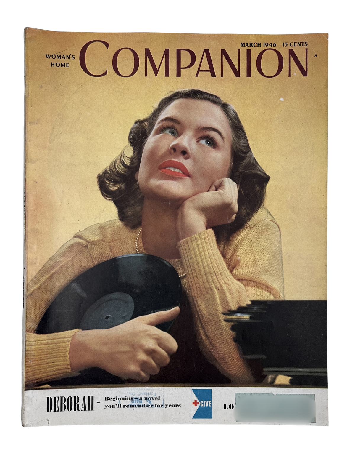 Vintage Woman’s Home Companion Magazine March 1946 cover featuring model Jackie McMillan, showcasing a classic hairstyle and holding a record. The cover includes the title 'Deborah' highlighting the issue.