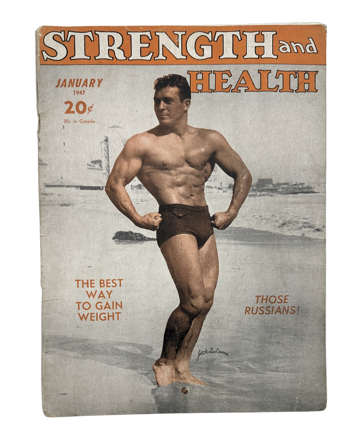 Cover of Strength and Health Magazine, January 1947 featuring Jack LaLanne showcasing a muscular physique on the beach.