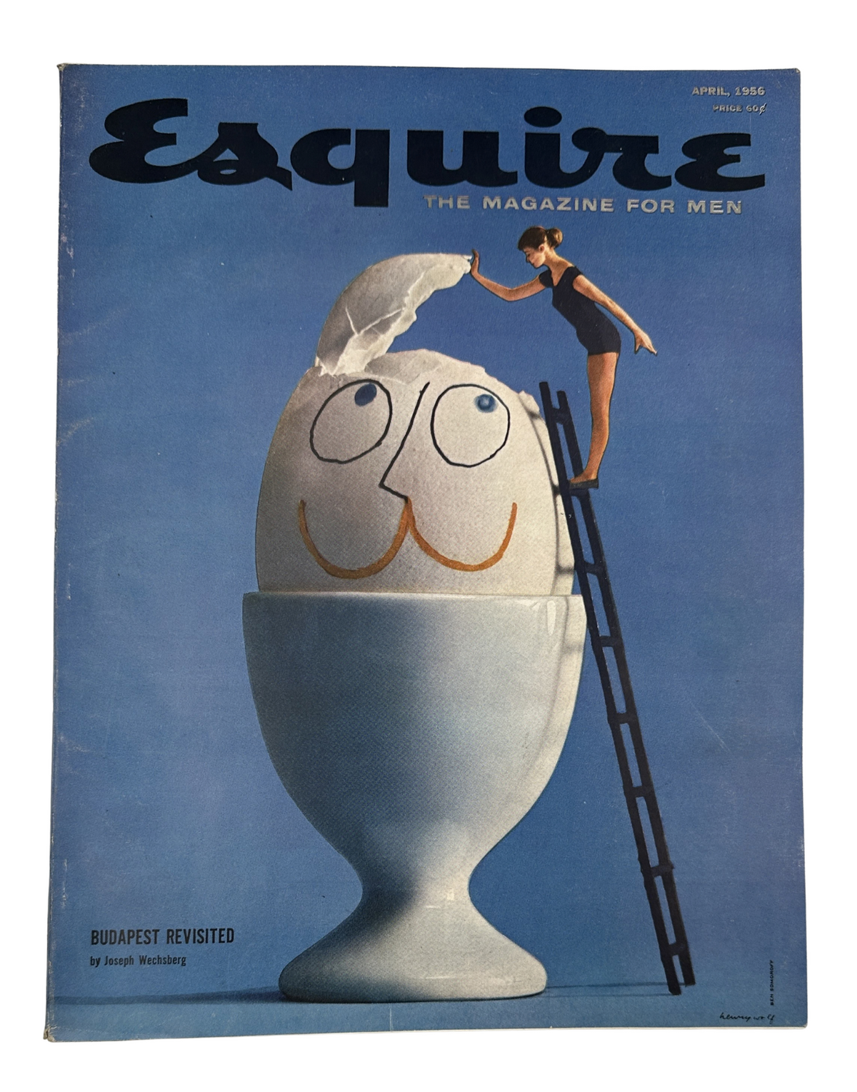Cover of Esquire Magazine April 1956 featuring a whimsical illustration of a smiling egg in an egg cup with a woman climbing a ladder, highlighting the theme 'Budapest Revisited'.