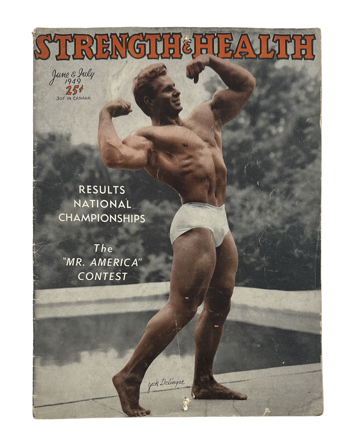 Strength and Health Magazine June-July 1949 cover featuring Jack Delinger, winner of the 'Mr. America' contest, showcasing a muscular pose. The cover highlights the magazine's focus on bodybuilding and fitness.