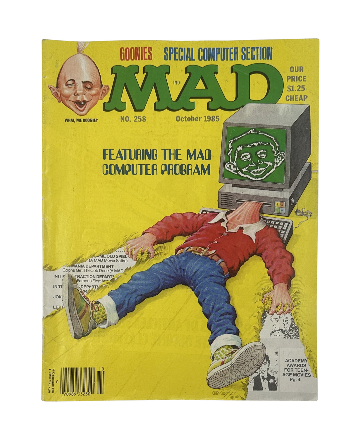 MAD Magazine No. 258 October 1985 featuring a parody of The Goonies and a special computer section, showcasing a character with a computer for a head on a bright yellow cover.