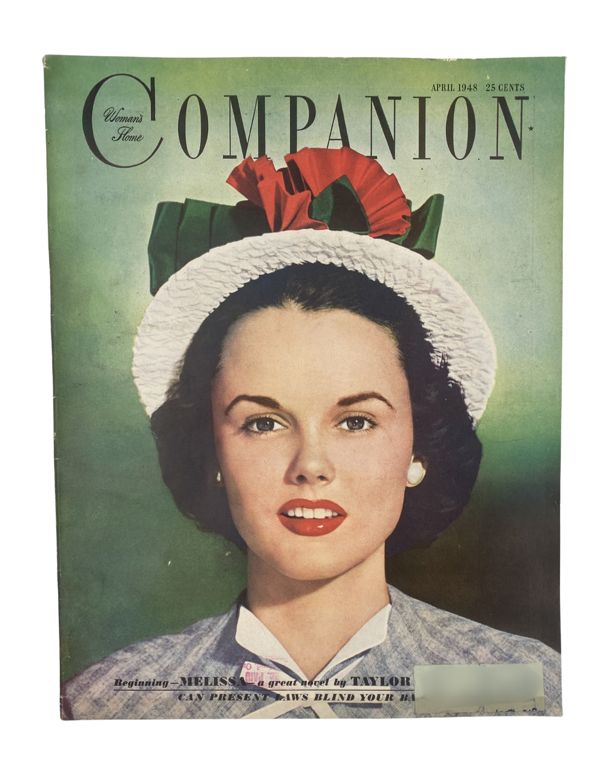 Woman's Home Companion Magazine April 1948 cover featuring a model in a white hat adorned with red flowers. The magazine showcases the title 'Melissa by Taylor Caldwell' and features a bright, colorful design.
