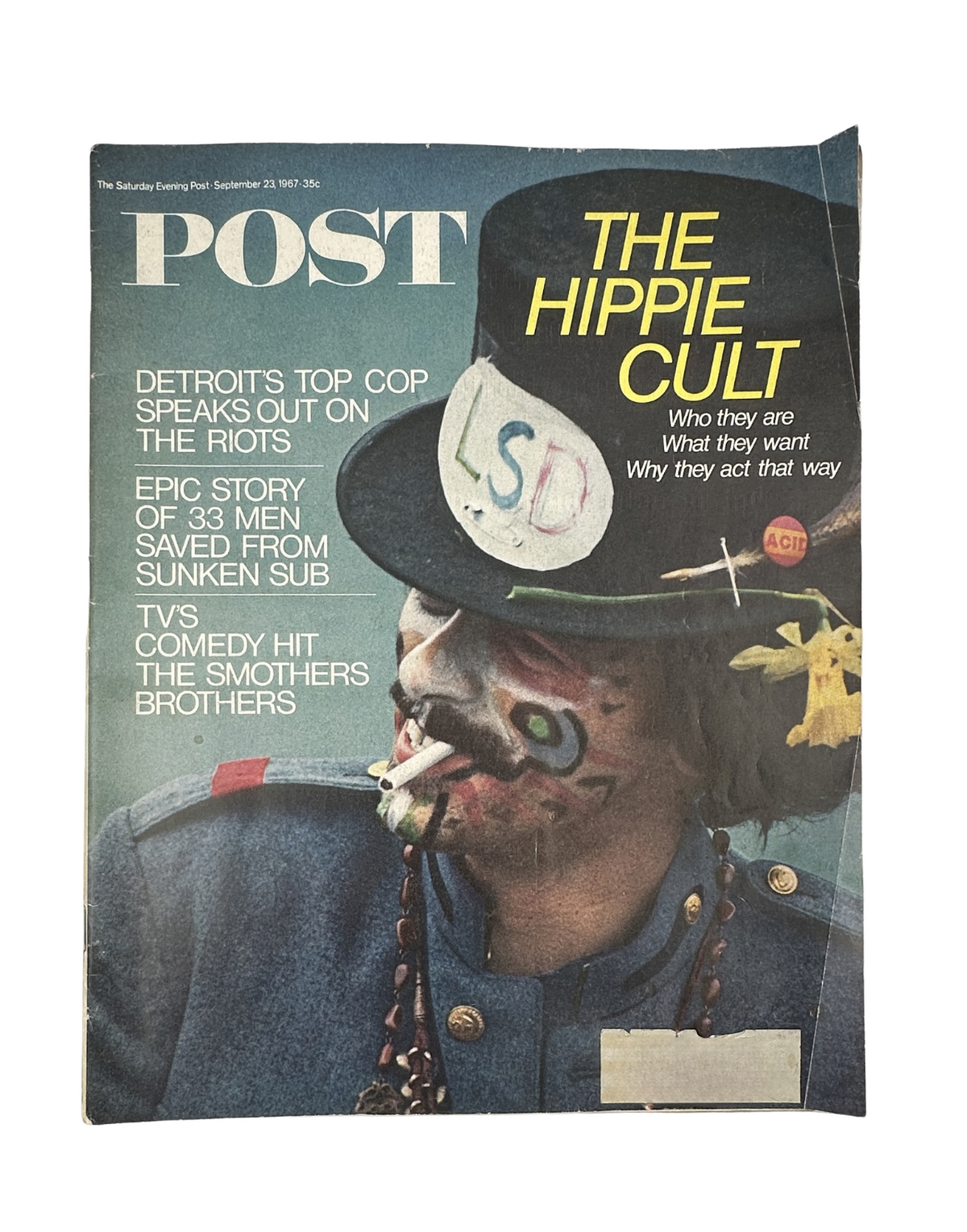 Cover of the Saturday Evening Post Magazine from September 23, 1967 featuring an article on the Hippie Cult with a colorful illustration including 'LSD' and depicting a decorated individual in a hat.
