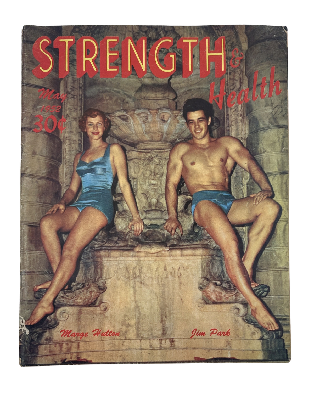 Strength and Health Magazine May 1952 cover featuring Marge Hulton and Jim Park, showcasing vibrant colors and a vintage aesthetic.