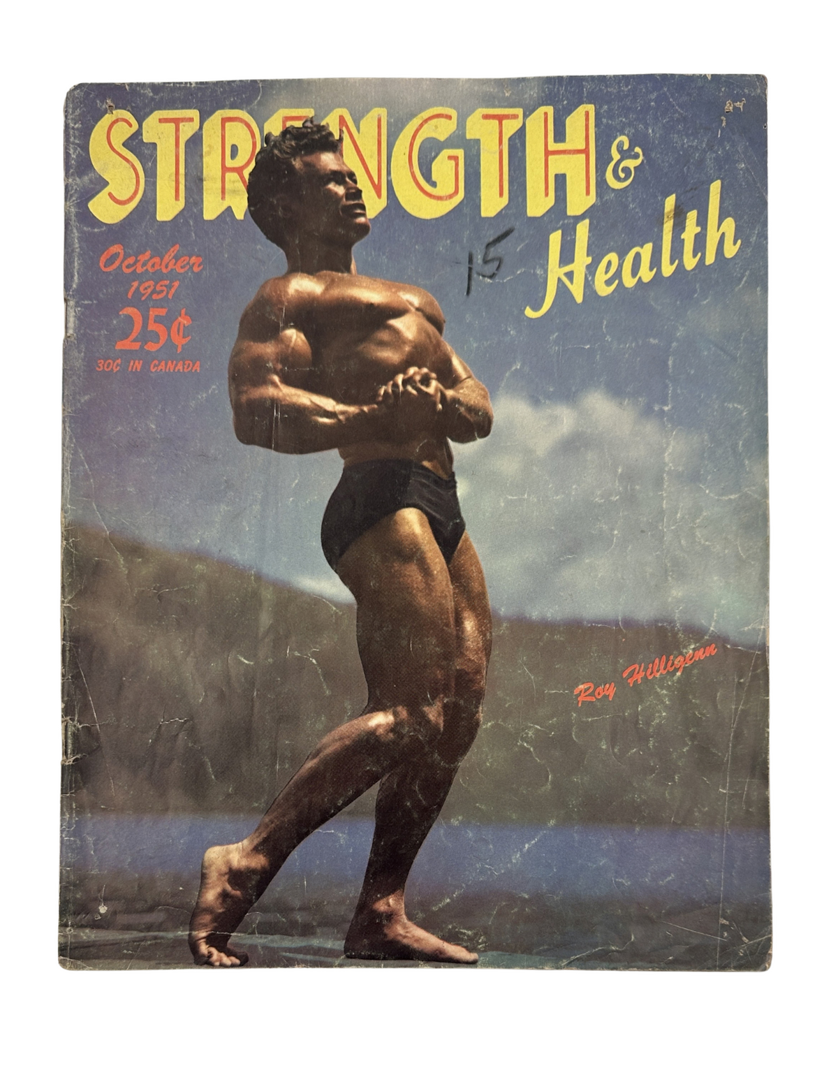 Strength and Health Magazine October 1951 featuring Roy Hilligenn on the cover, showcasing a vintage fitness theme and bodybuilder in a classic pose.